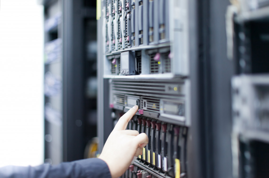 a person handling a server