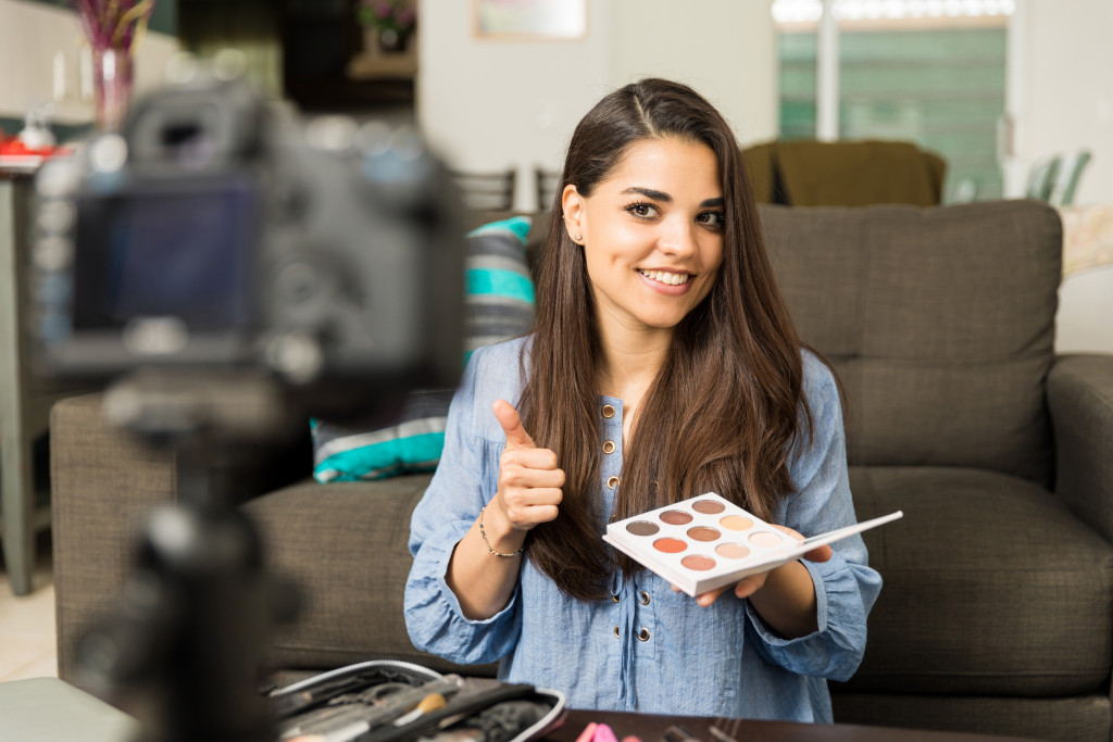 woman reviewing a makeup kit