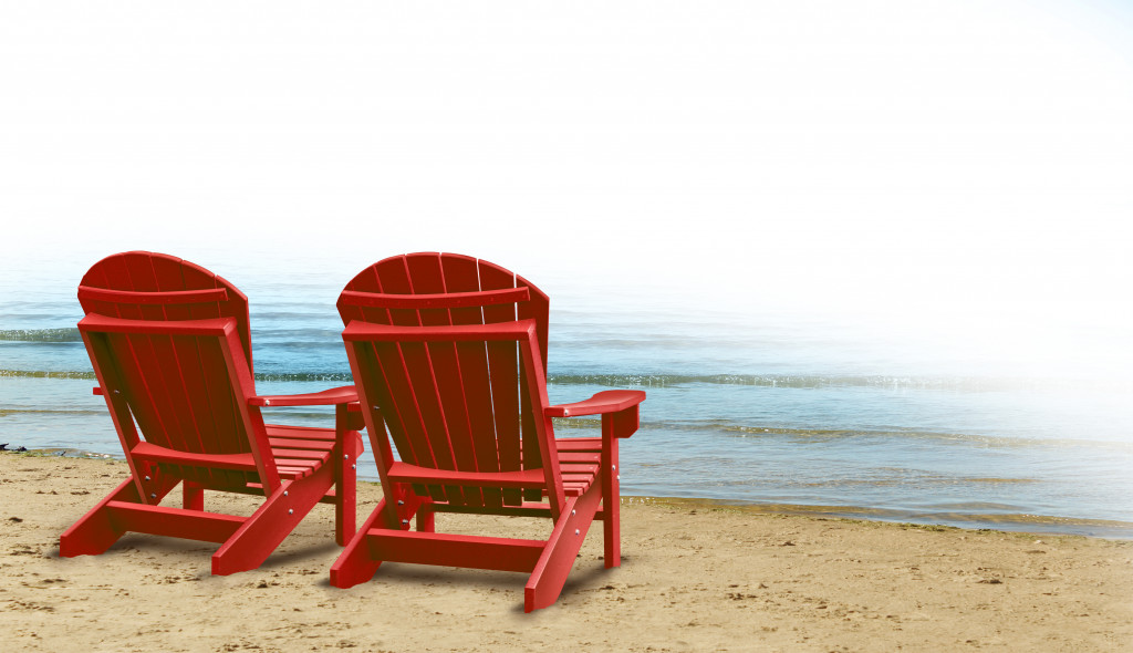Two red chairs on the beach