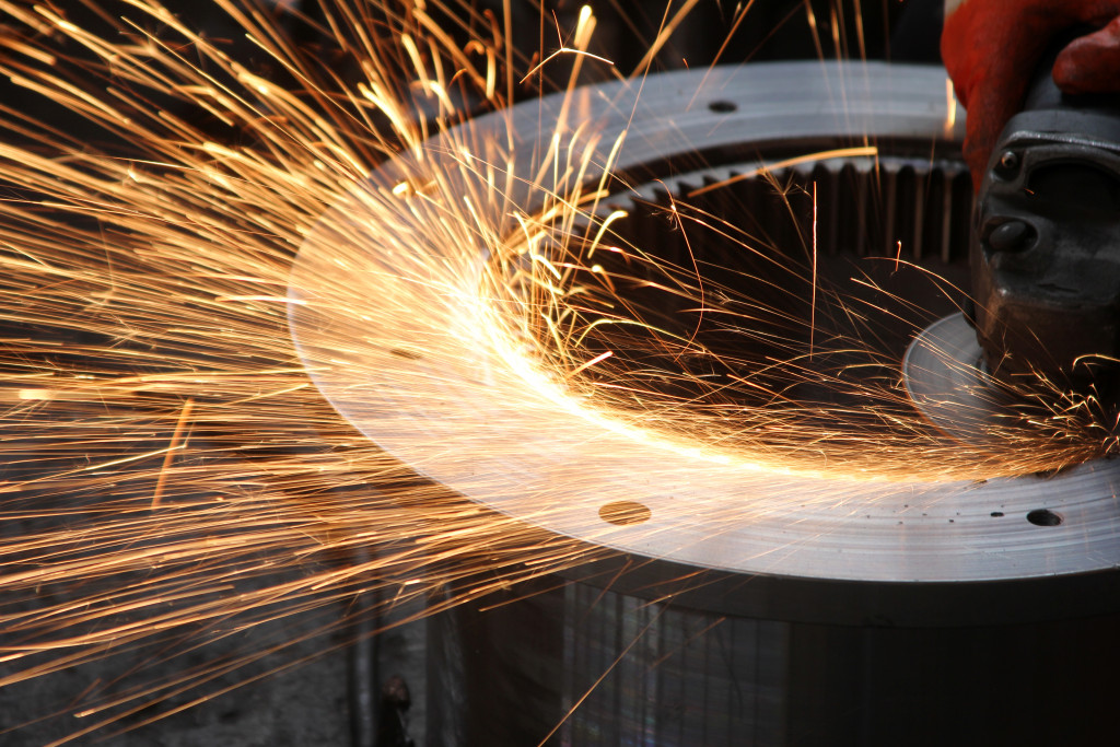 Sparks flying from a metal ring being welded