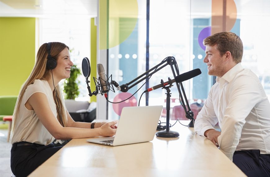 woman interviewing a guest for a podcast